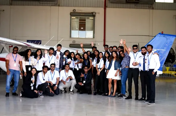 Students with training aircraft in the hangar at Global Pilot Academy Florida